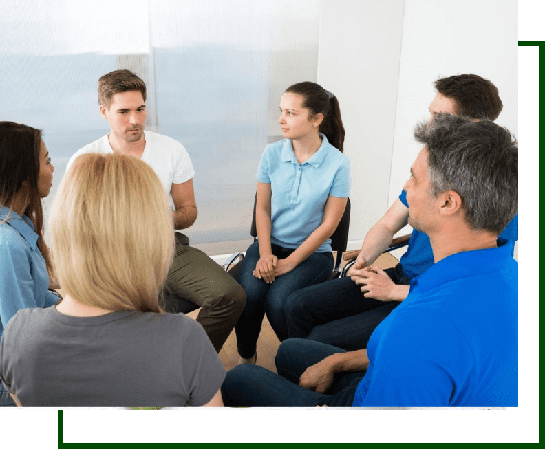 A group of people sitting in a circle.