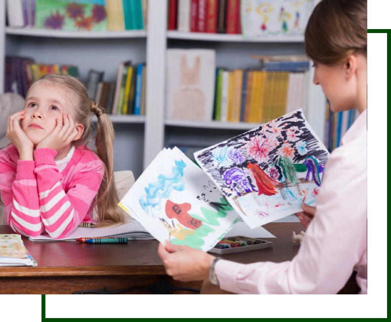 A woman showing a child some pictures