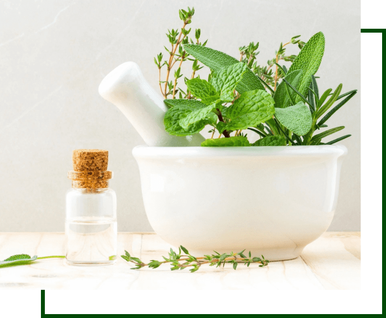 A mortar and pestle with herbs in it.