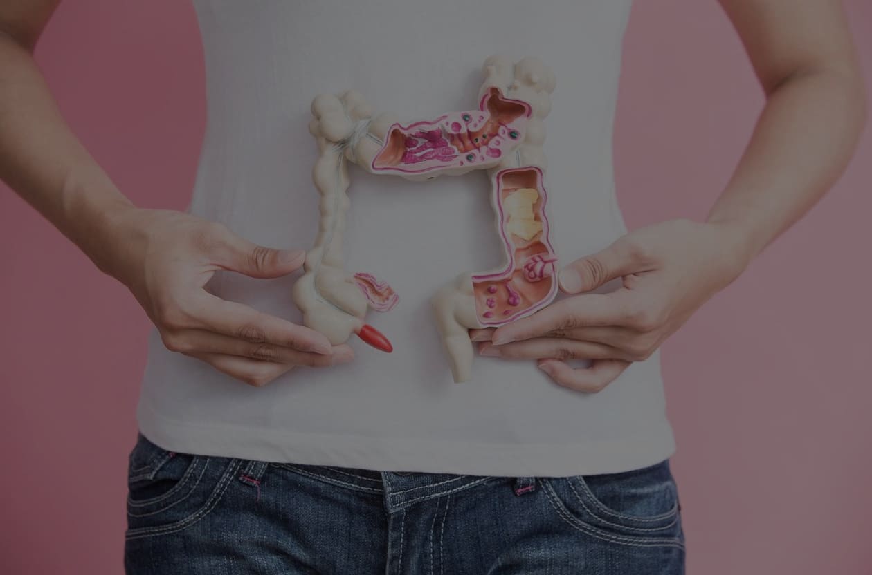 A person holding up their stomach with food in the shape of an animal.