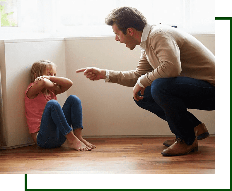 A man and a little girl sitting on the floor