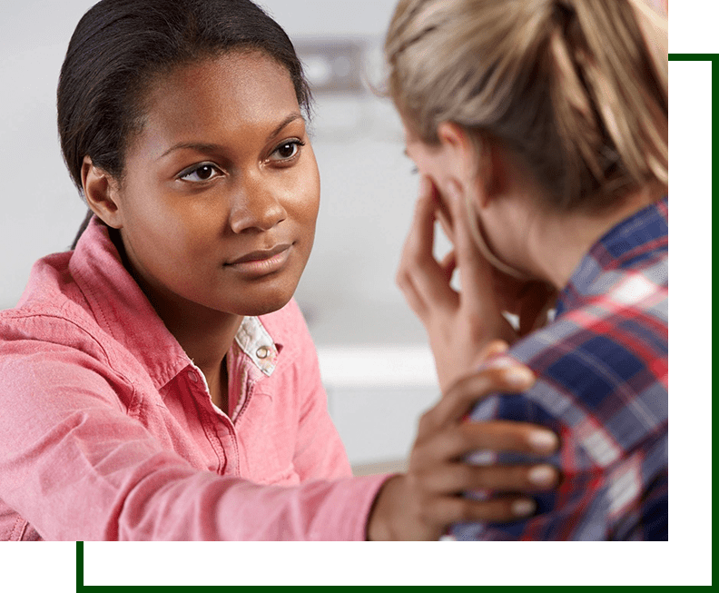 A woman talking to another person in front of her.